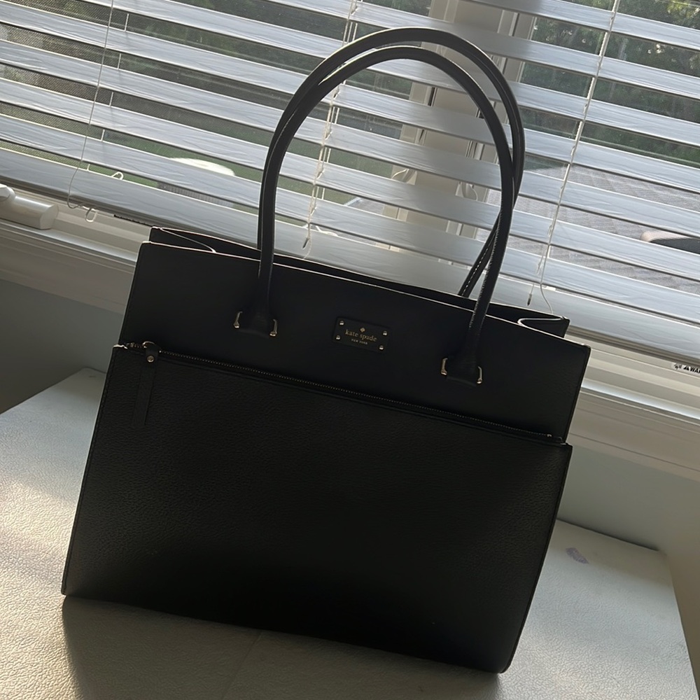 Black Kate Spade laptop bag with gold detailing.